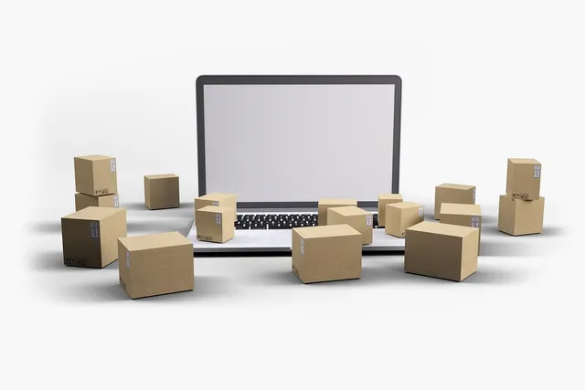3D render of an open laptop with a blank screen surrounded by small cardboard shipping boxes on a white background