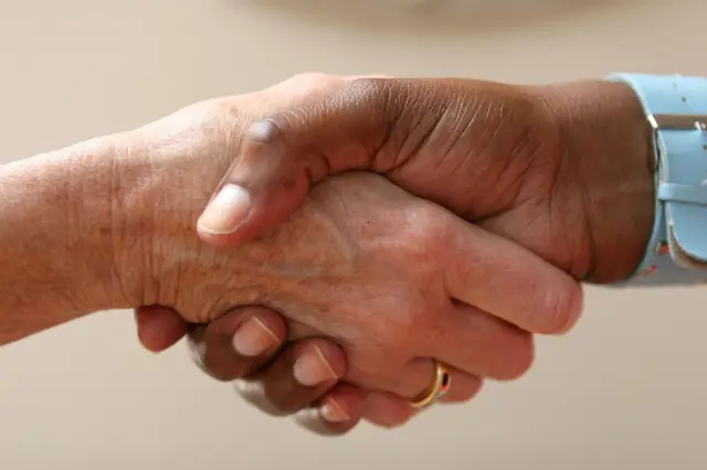 Close-up of two people shaking hands