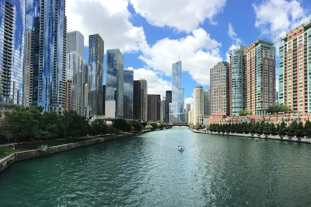 City skyline of high-rises along a river on a sunny day
