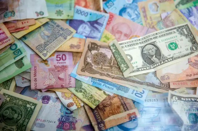 Pile of banknotes from many different countries