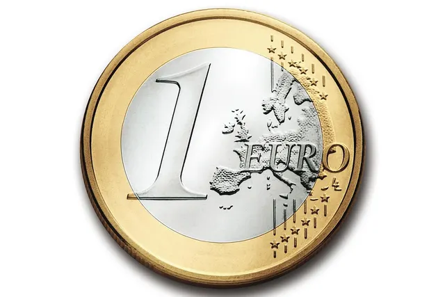 Close-up of a bimetallic 1 euro coin showing a map of Europe and stars, isolated on a white background