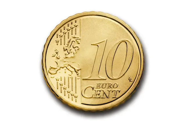 Close-up of a gold 10 euro cent coin with a map of Europe and stars, isolated on a white background